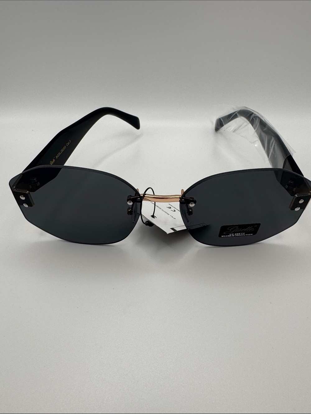 Stylish Black Rimless Women's Sunglasses with Gold Bridge